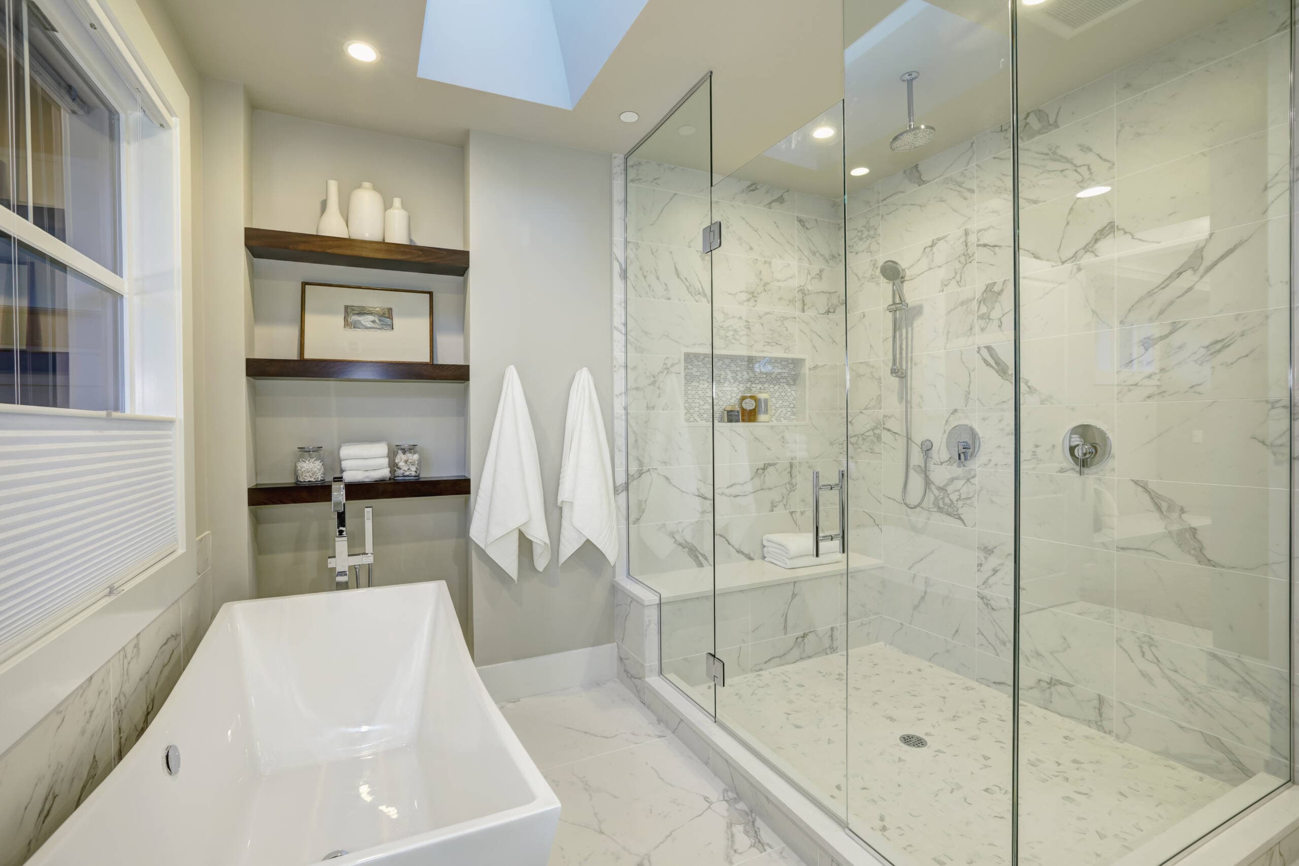 Luxury marble bathroom remodel in Southlake, TX with frameless glass shower